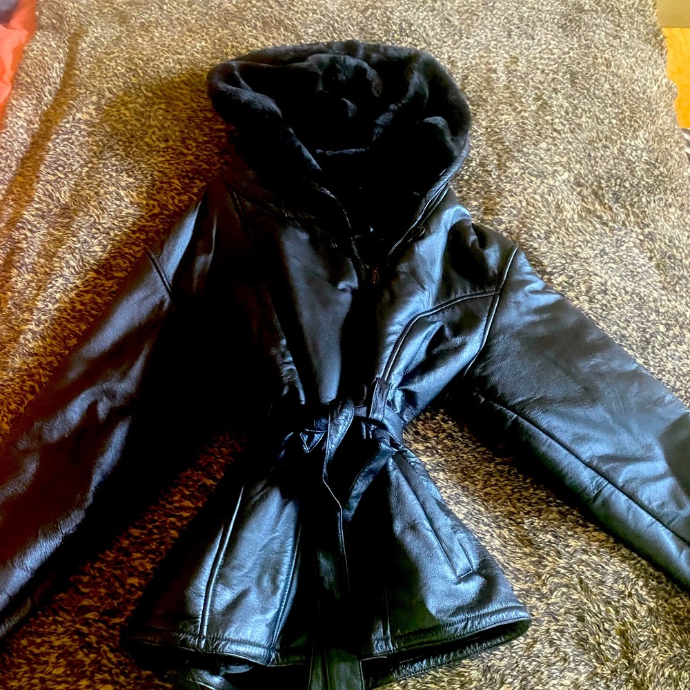 Wilson’s black leather heavy duty jacket, black fur lining and never been worn!